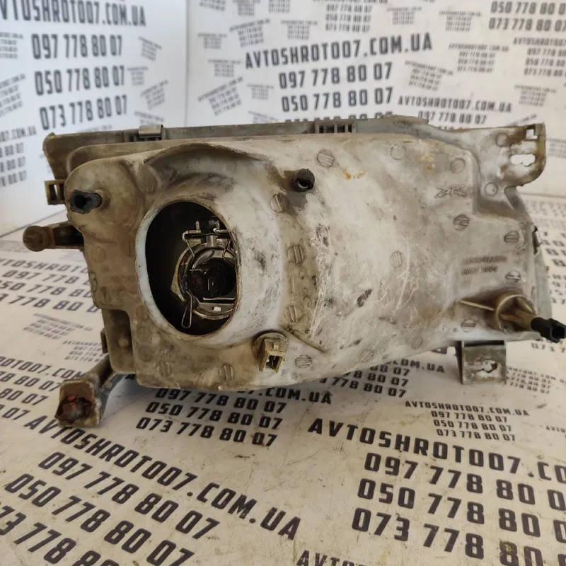 Фара Ford Transit (94-00) ліва OEM 205212b