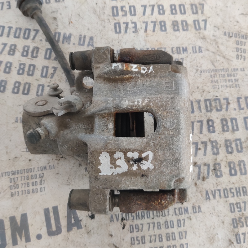 Тормозний супорт Mazda 3 BK передній правий OEM 619802H105S