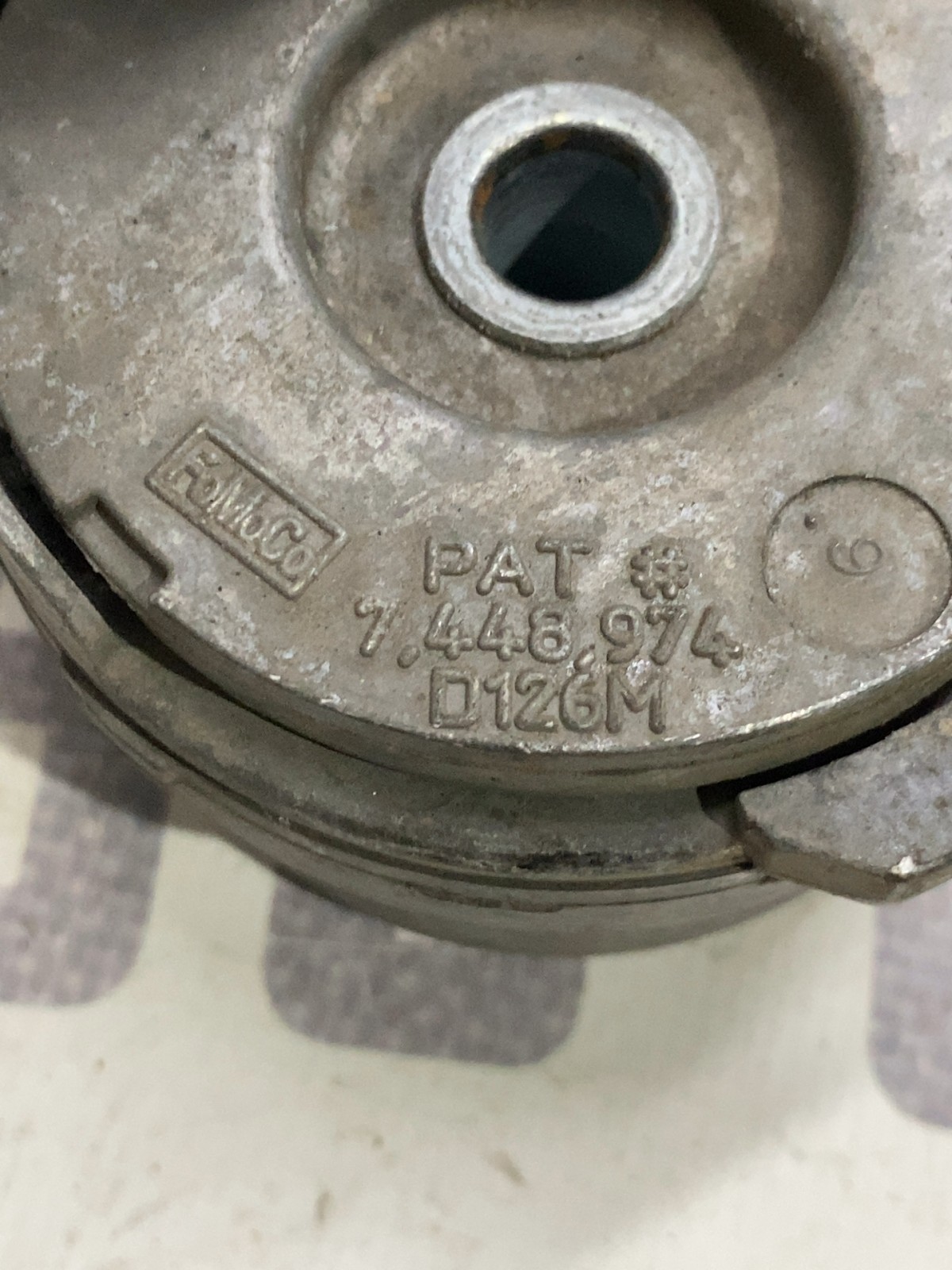 Ролик-натяжник ремня лівий Ford F-150 (09-14) 7448974