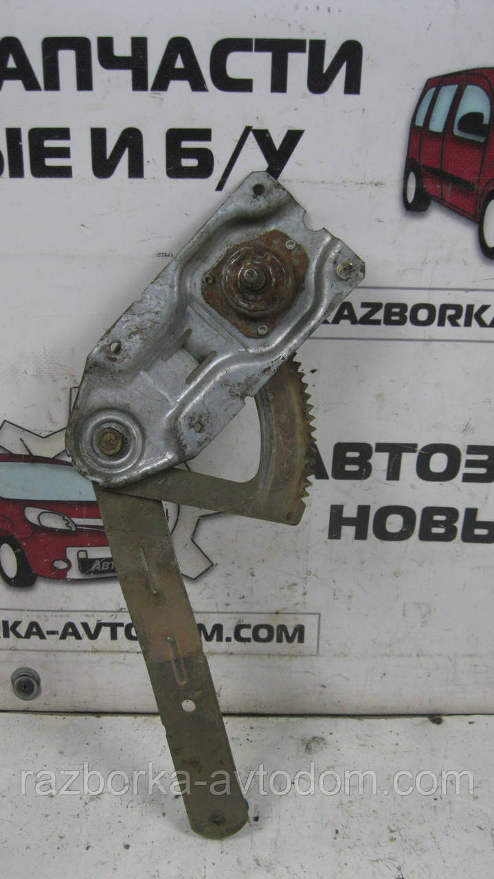 Склопідіймач задній лівий (механічний) Ford Escort 5 (1990-1995) OE:91ABA270CC1AC