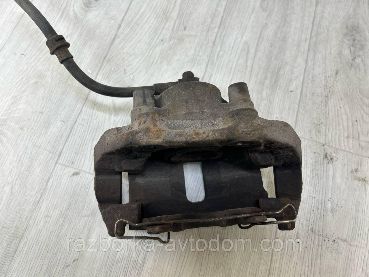 Суппорт Передній лівий Opel Omega B (93-99) OE:90509196