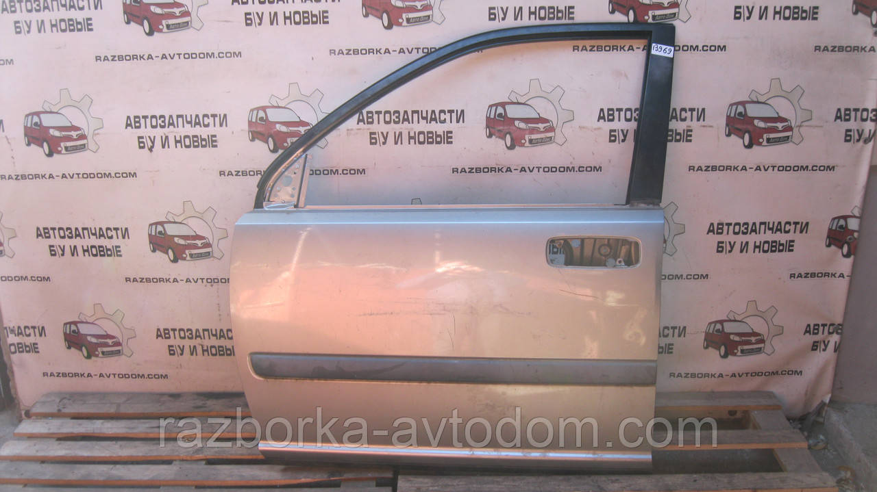 Двері передня ліва Nissan X-trail T30 (01-07) OE: H01018H7MM Дефект: подряпини та вм'ятинка незначна