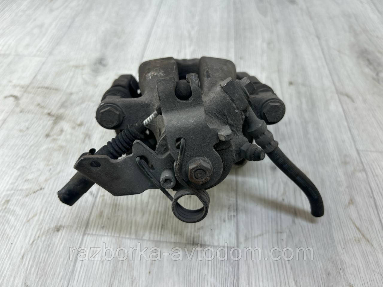 Суппорт задній лівий Opel Astra H (04-14), Astra G, Zafira A, Combo OE:95516266