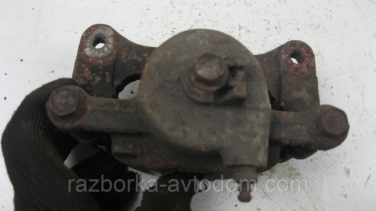 Суппорт передній лівий Nissan Sunny B11 (1982-1986), B12, N13 (1986-1988) OE:4101105A90