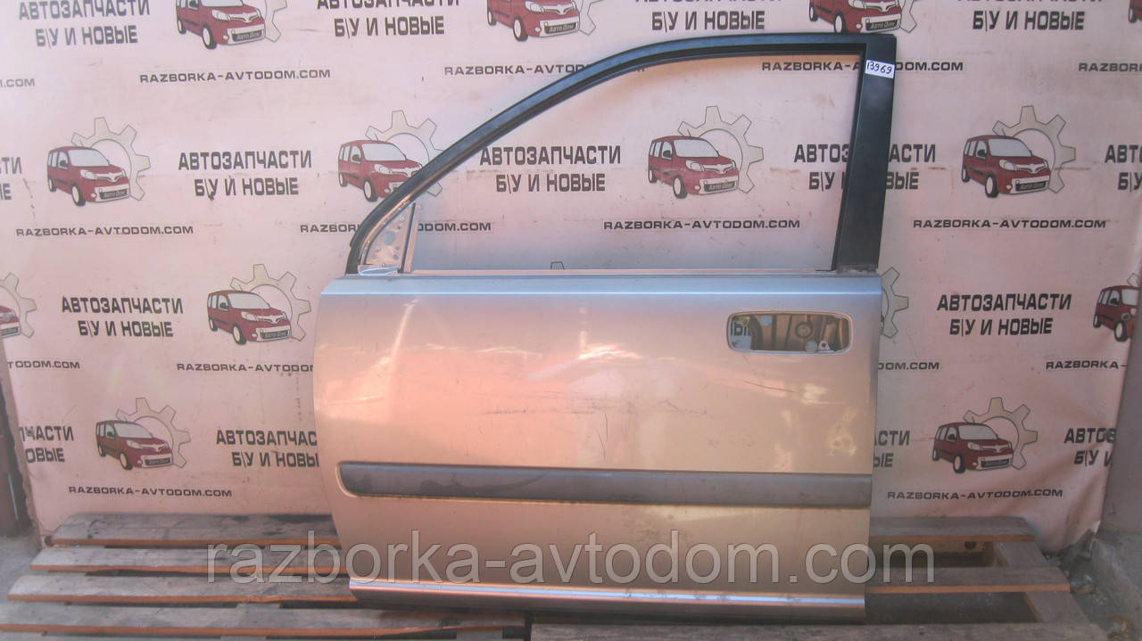 Двері передня ліва Nissan X-trail T30 (01-07) OE: H01018H7MM Дефект: подряпини та вм'ятинка незначна