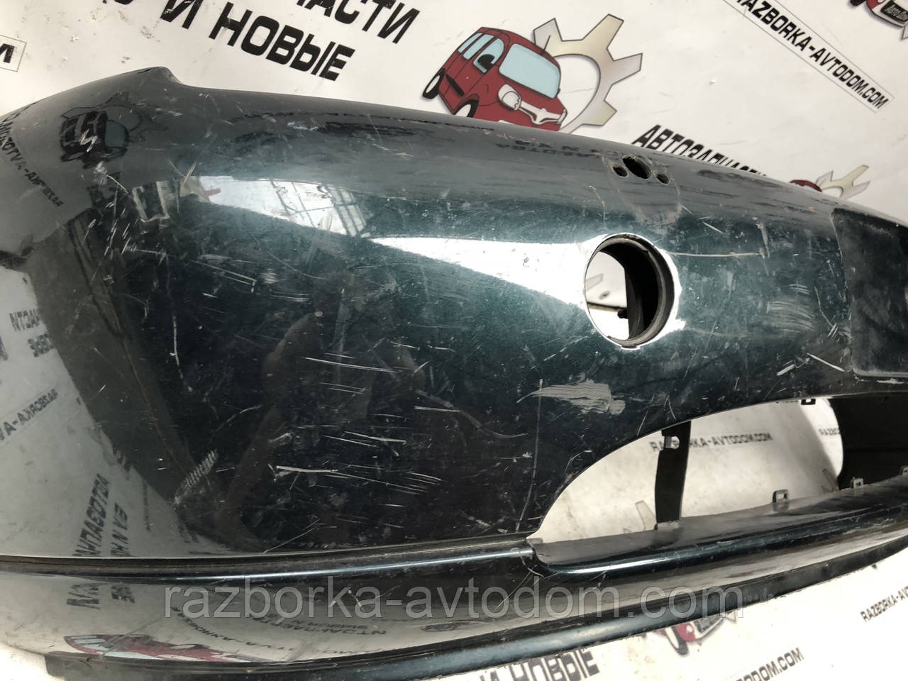 Бампер передній Ford Fiesta/Courier (95-99) 1094623