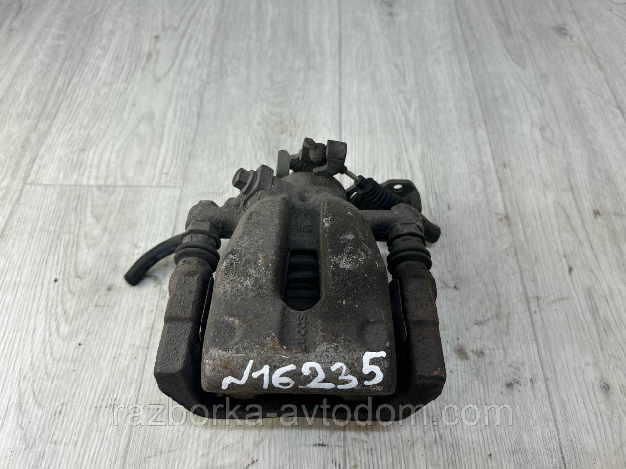 Суппорт задній лівий Opel Astra H (04-14), Astra G, Zafira A, Combo OE:95516266