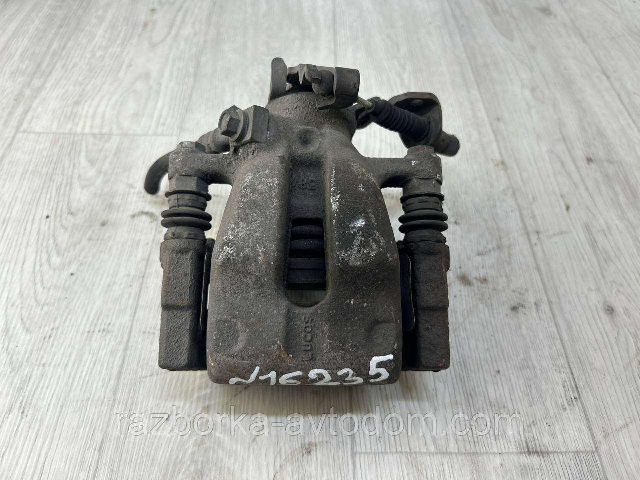 Суппорт задній лівий Opel Astra H (04-14), Astra G, Zafira A, Combo OE:95516266